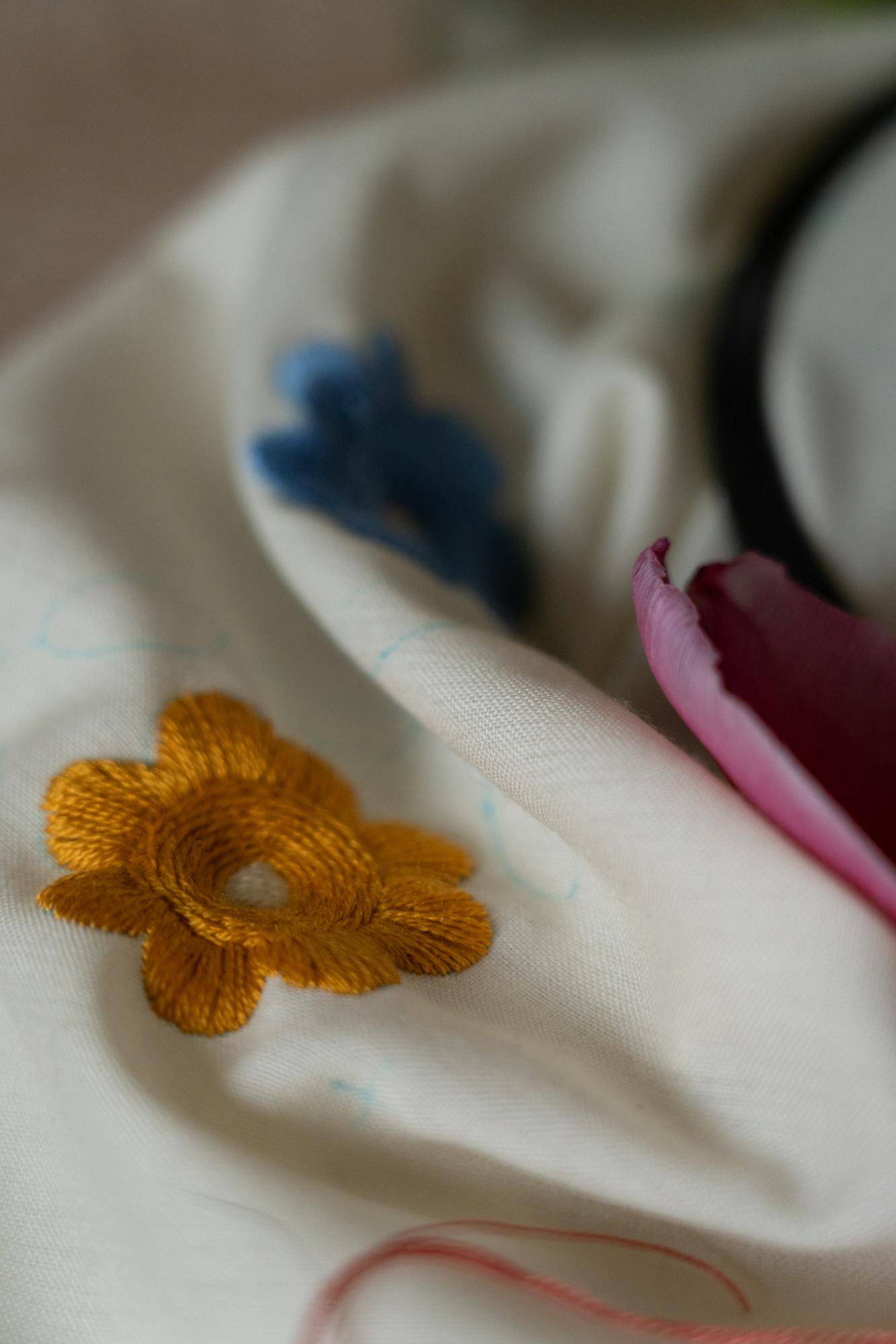 Close-up hand embroidery on linen